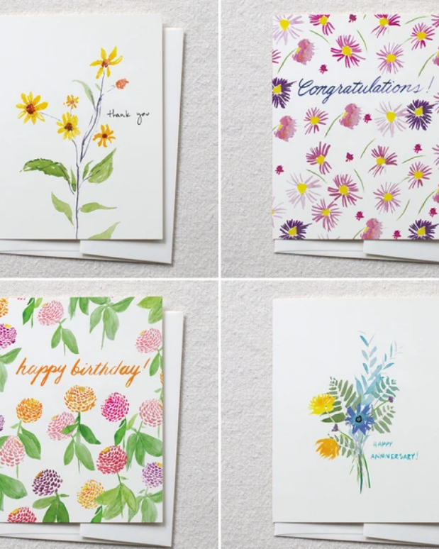 photo image of four cards that make a set with watercolor flowers and text reading 'happy birthday' 'thank you' 'congratulations' and 'happy anniversary's