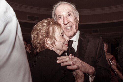 photo of senior couple slow dancing and smiling