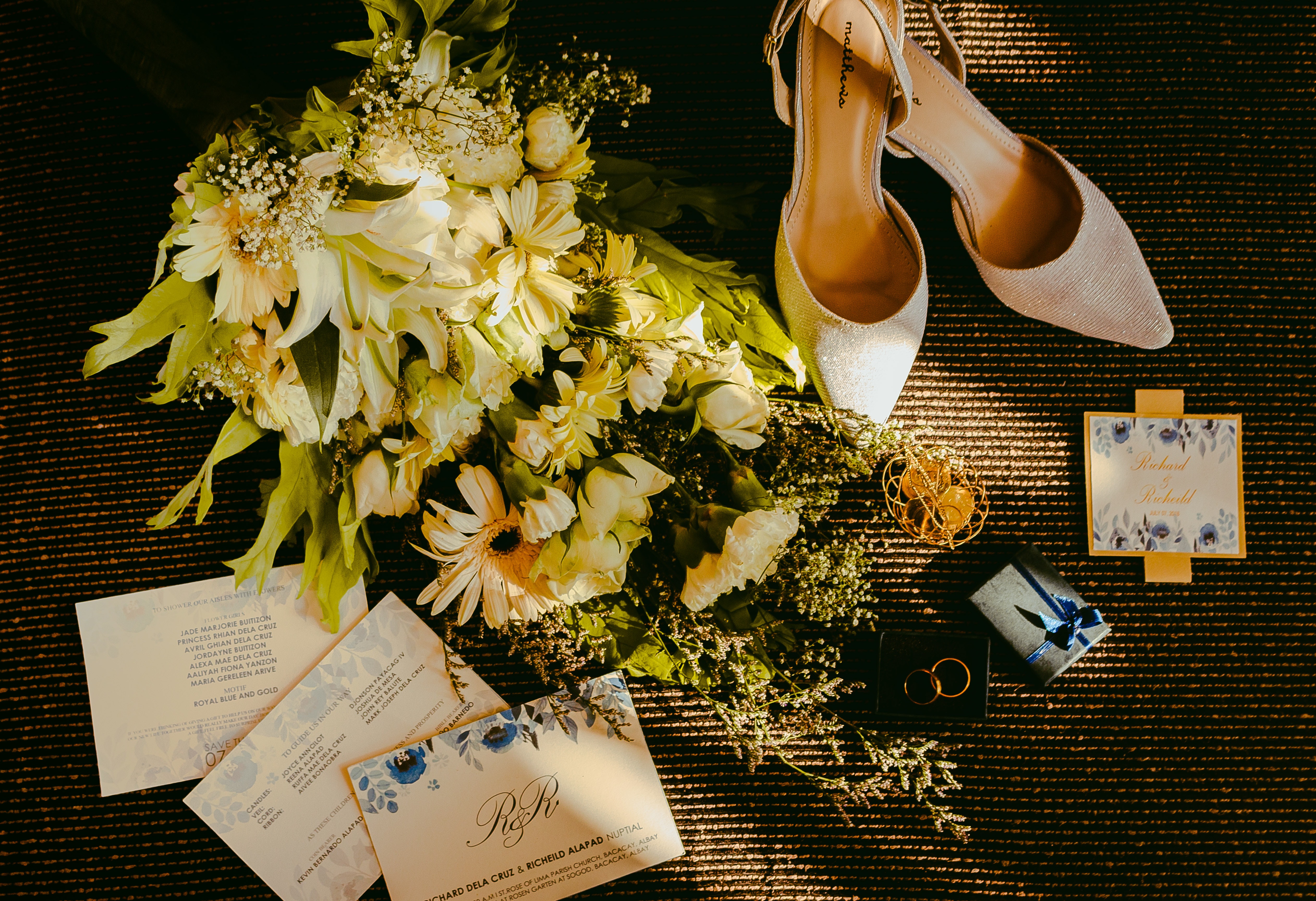 wedding shoes, flowers, and invitations