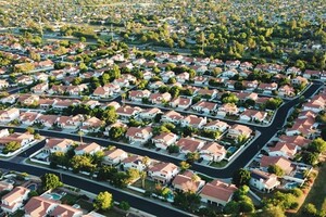 aerial shot of suburban homes and trees