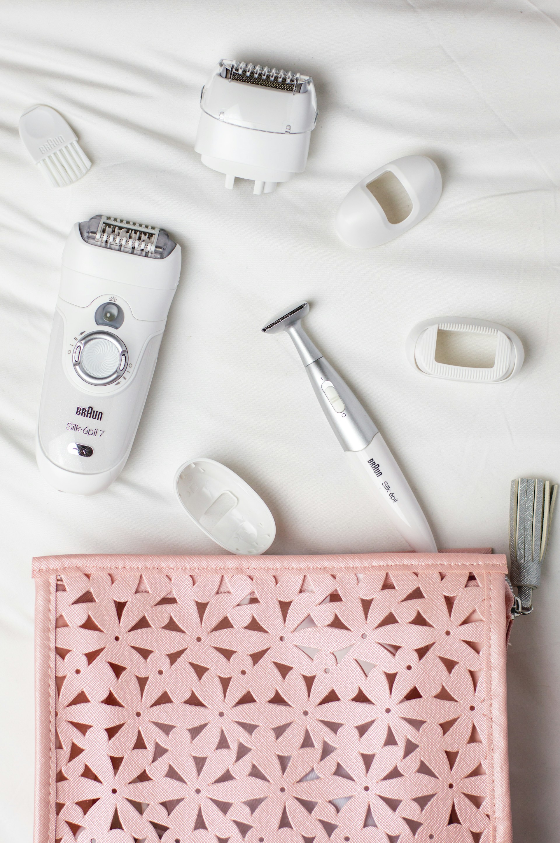 photo: clippers and eyelash shaper spillinh out of a purse