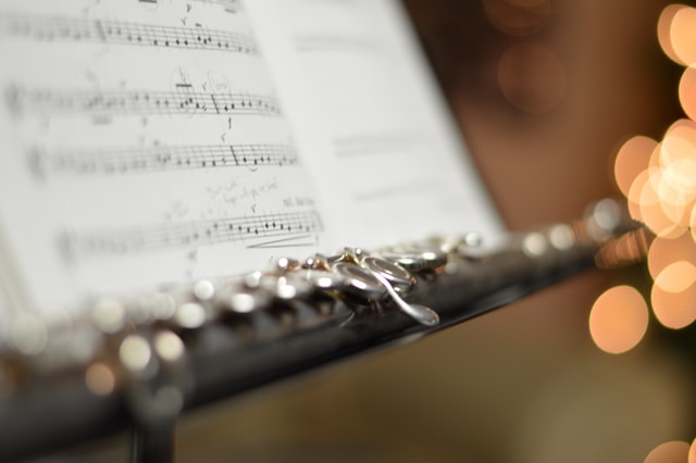 photo: flute resting on a music stand