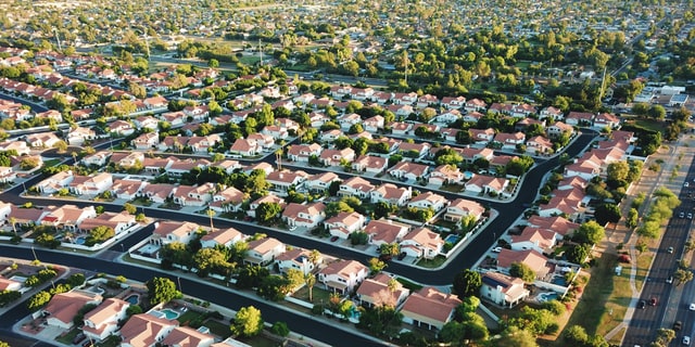 aerial shot of suburban homes and trees