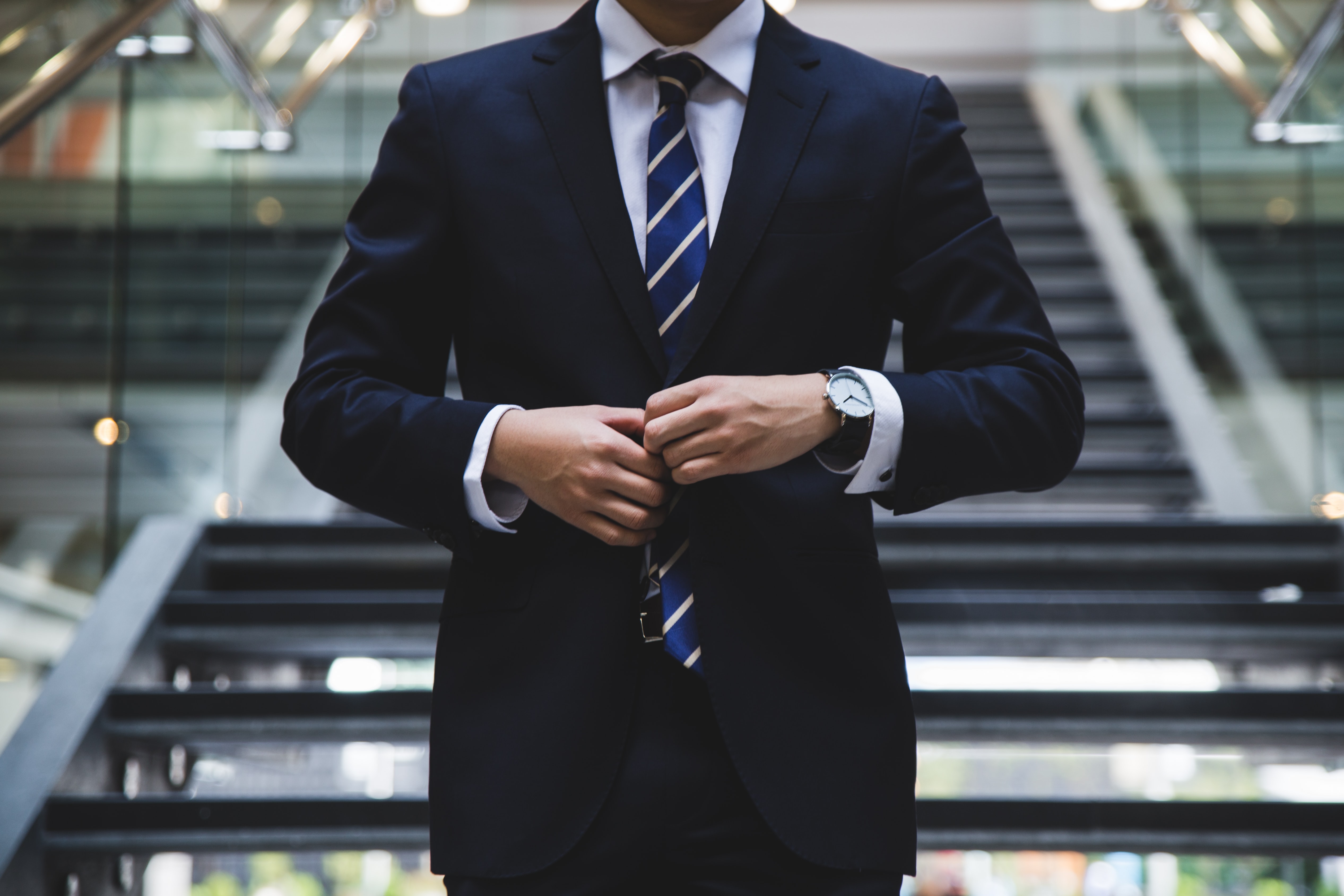 Business Formal: Dark suit and tie