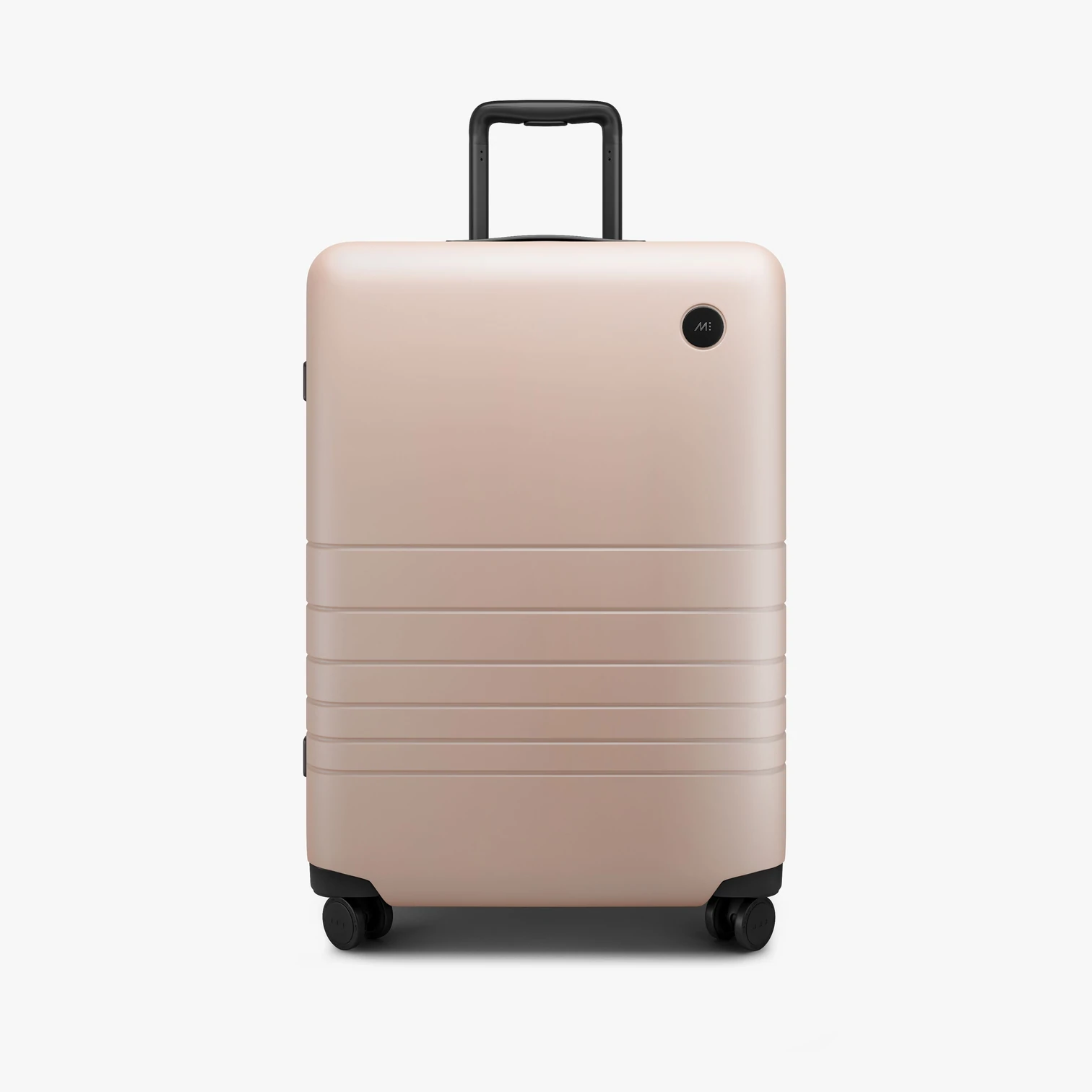 A soft pink medium sized piece of luggage with fully rotating wheels. Click this image to be taken to the MONOS website to purhase high end luggage