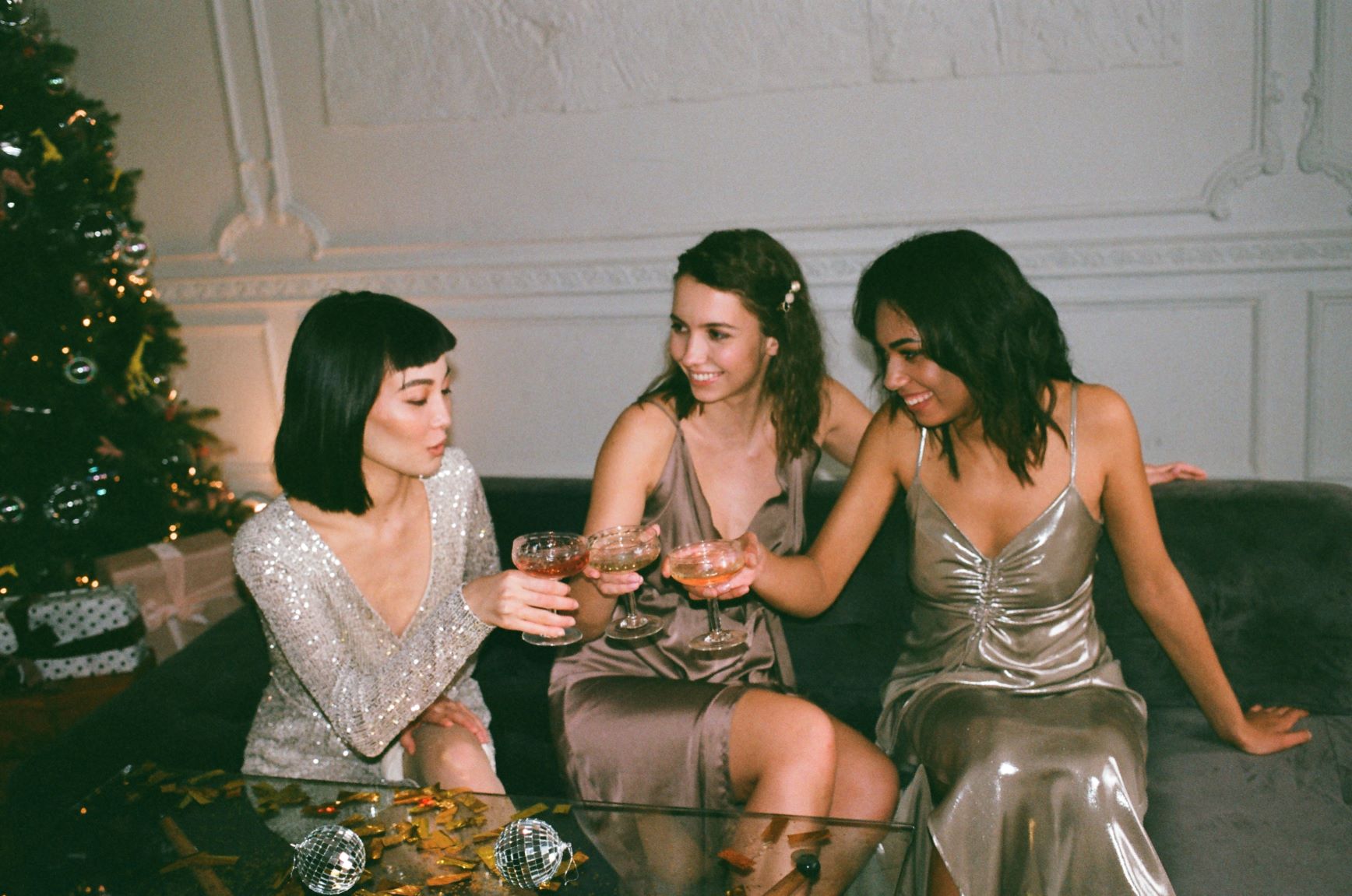 Three women in cocktail dresses