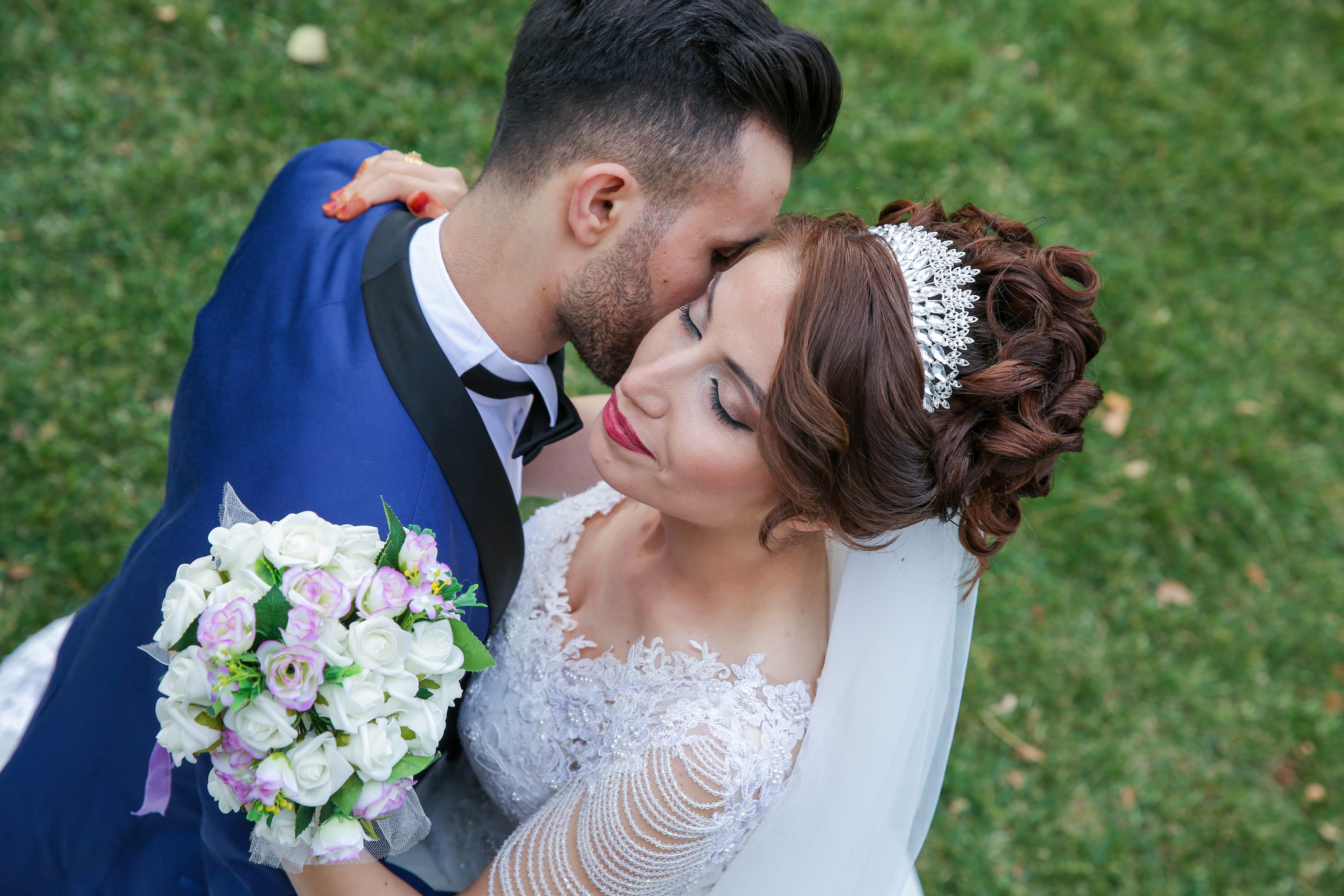 bride and groom embracing one another